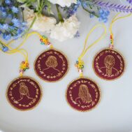 rebirth embroidered charm