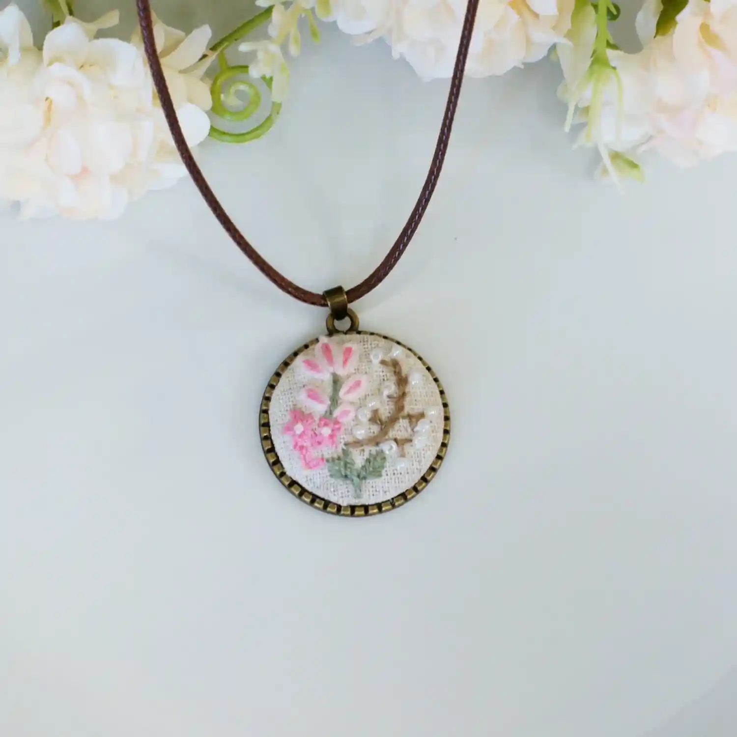 embroidered pink floral pendant