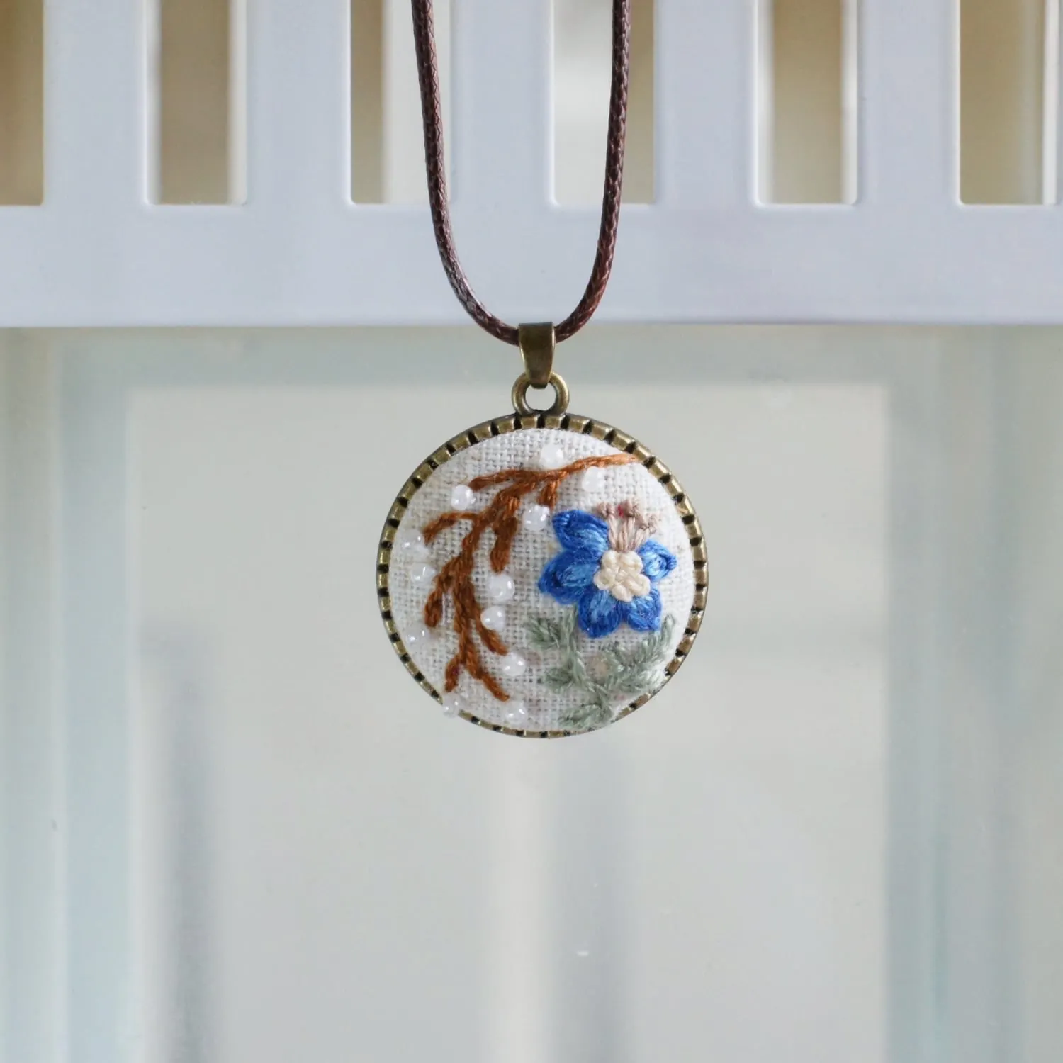 beaded embroidered floral pendant