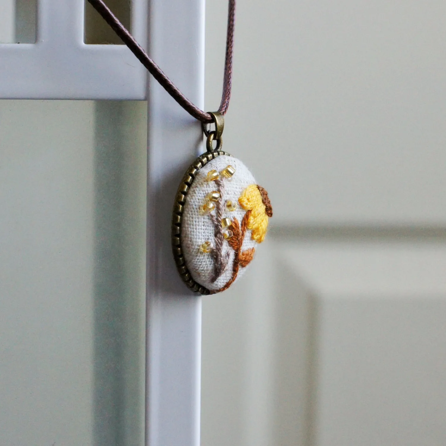 embroidered sunflower floral pendant