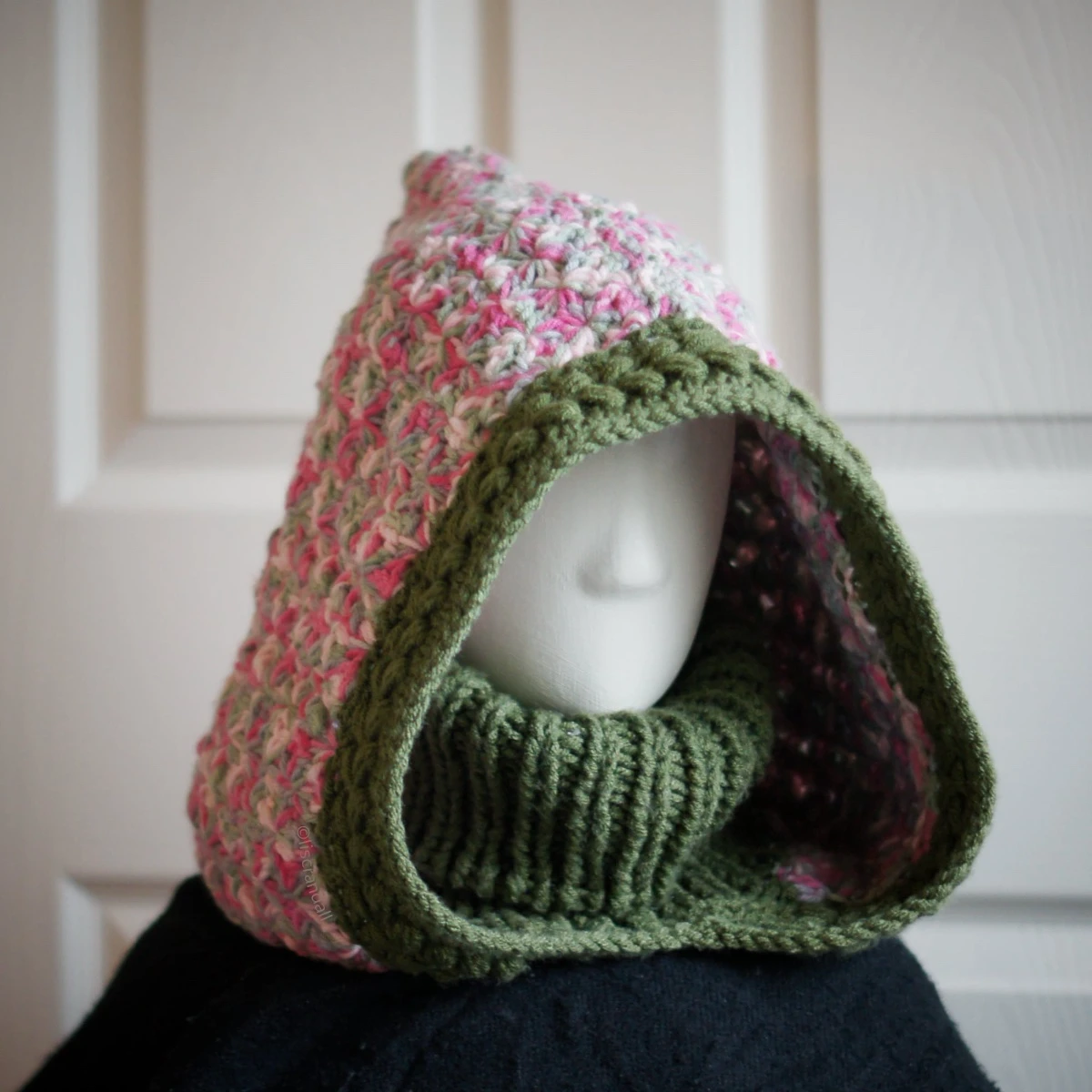 Oversized jasmine wheat knit balaclava with dusty rose turtleneck, side view showing texture detail