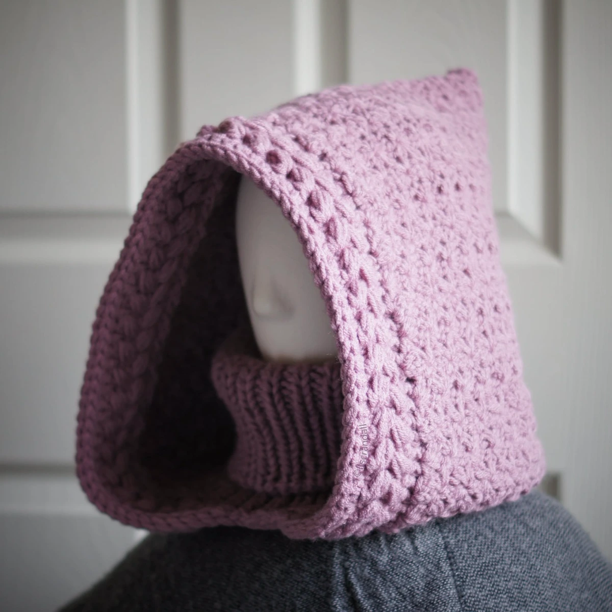 Knitted balaclava hood in mauve showing jasmine wheat texture detail