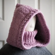 Knitted balaclava hood in mauve showing jasmine wheat texture detail