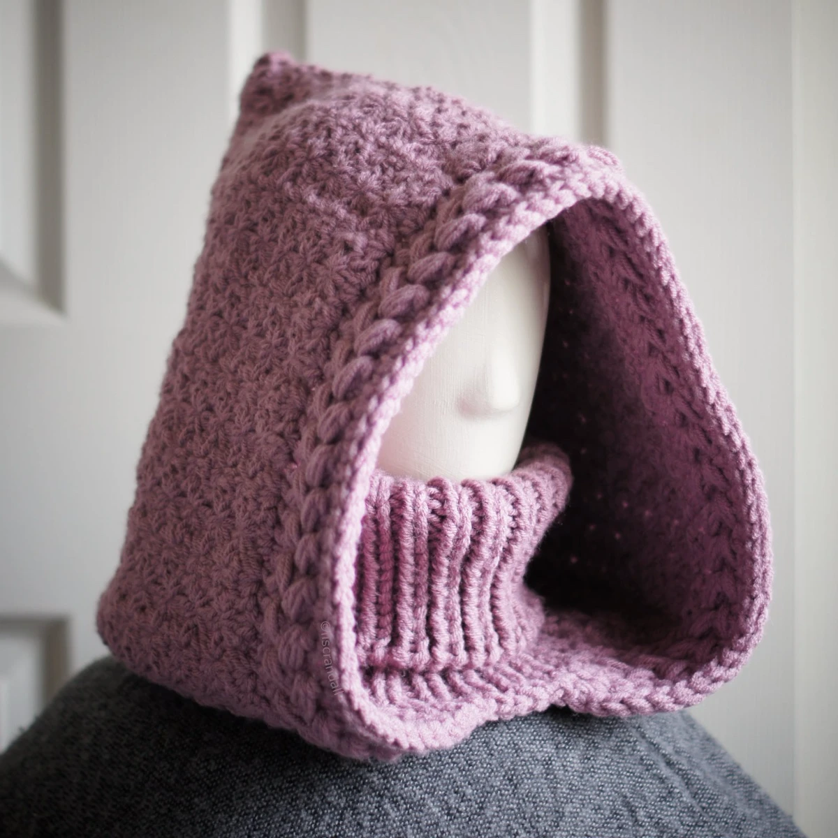 Knitted balaclava hood in mauve showing jasmine wheat texture detail