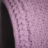 Close-up of jasmine wheat knit stitch on mauve balaclava