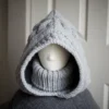 Handmade knitted balaclava in light grey with cable details and wheat stitch edging, front view with turtle neck