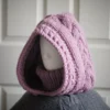 Chunky knit balaclava in mauve with cable details and wheat stitch edging, side view with cable details