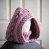 Chunky knit balaclava in mauve with cable details and wheat stitch edging, side view with cable details
