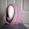 Chunky knit balaclava in mauve with cable details and wheat stitch edging, side view with cable details and different styling