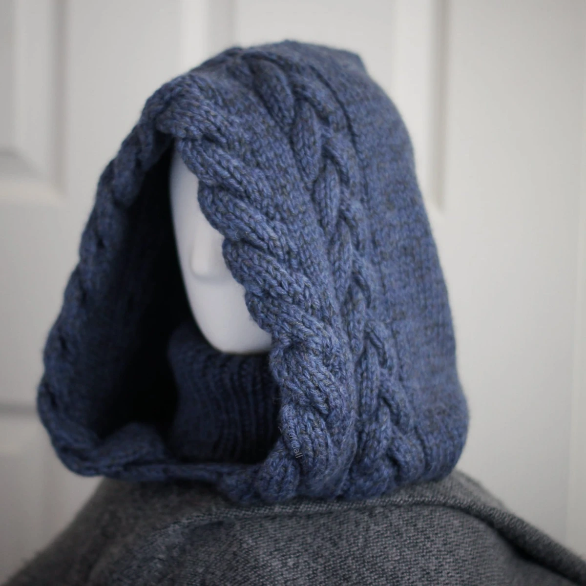 Side view of blue merino balaclava hood showing cozy fit