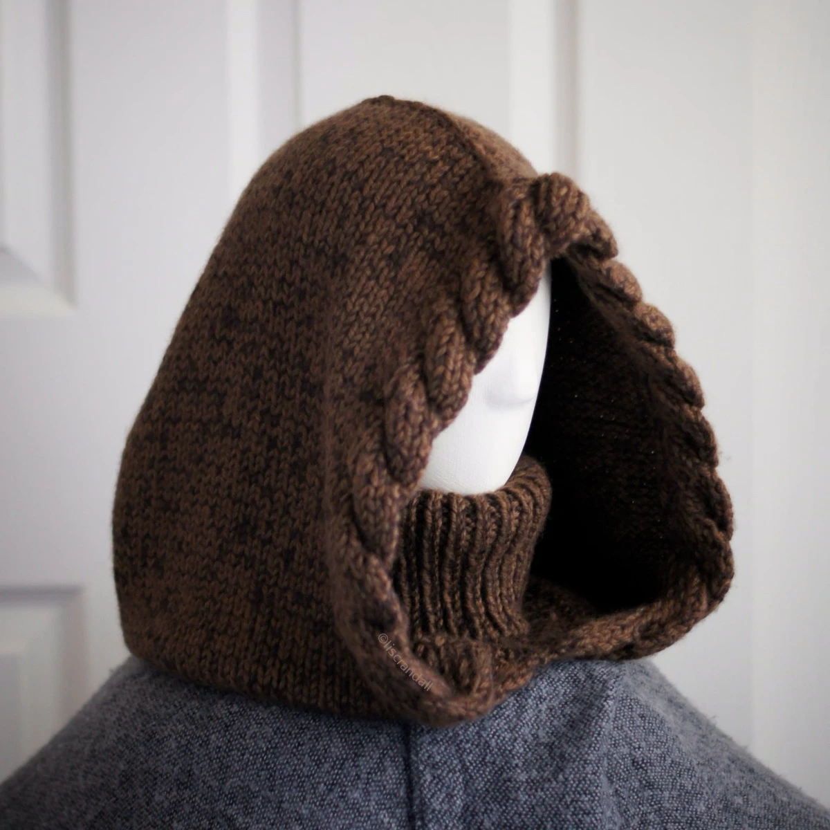 Brown merino balaclava with braided texture on mannequin