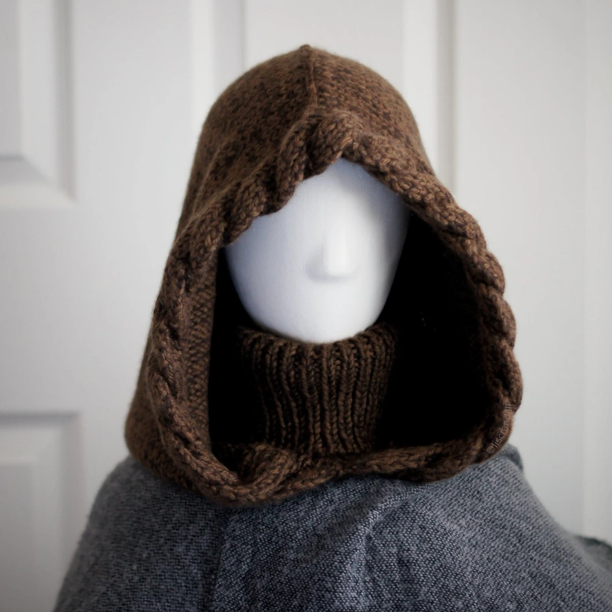 Brown merino balaclava with braided texture on mannequin