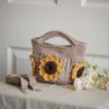 crochet mini bag in khaki color formed with 3D sunflower granny squares. Comes with adjustable strap.
