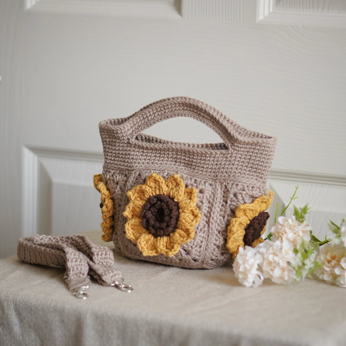 crochet mini bag in khaki color formed with 3D sunflower granny squares. Comes with adjustable strap.