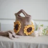 crochet mini bag in khaki color formed with 3D sunflower granny squares. Comes with adjustable strap.