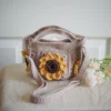 crochet mini bag in khaki color formed with 3D sunflower granny squares. Comes with adjustable strap.