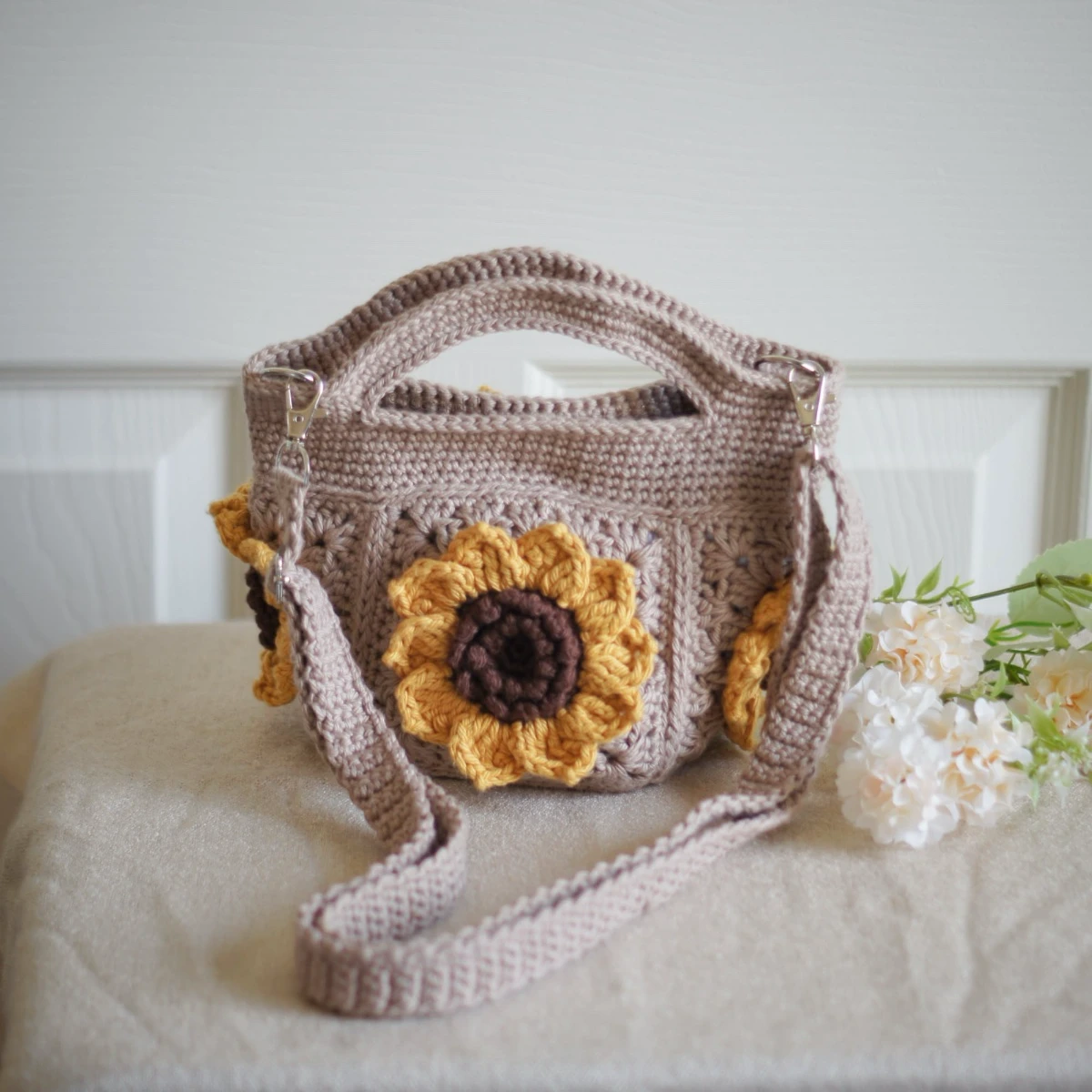 crochet mini bag in khaki color formed with 3D sunflower granny squares. Comes with adjustable strap.