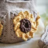 Close up of crochet mini bag in khaki color formed with 3D sunflower granny squares. Comes with adjustable strap.