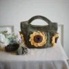 crochet mini bag in olive green color formed with 3D sunflower granny squares. Comes with adjustable strap.