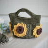 crochet mini bag in olive green color formed with 3D sunflower granny squares. Comes with adjustable strap.