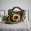 crochet mini bag in olive green color formed with 3D sunflower granny squares. Comes with adjustable strap.
