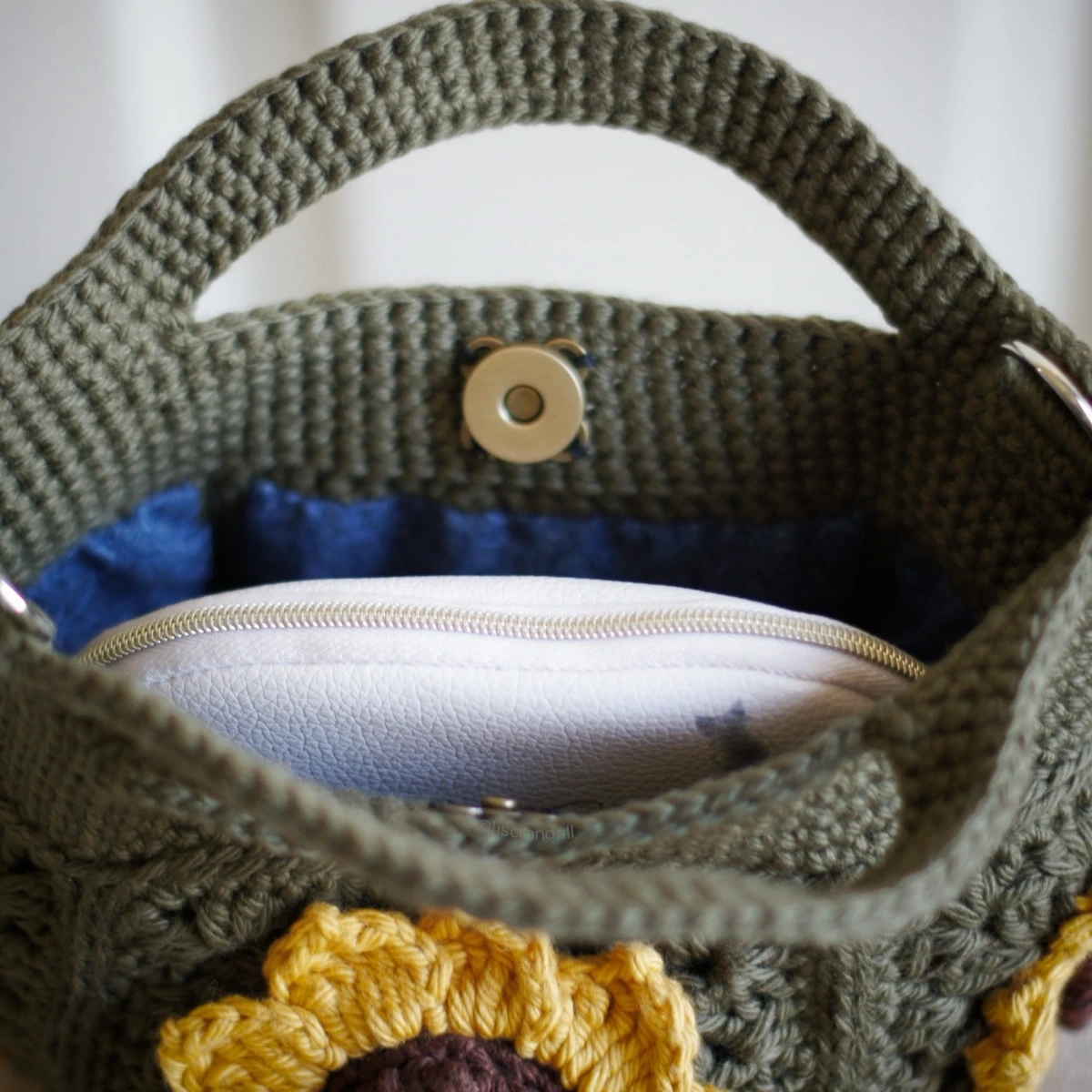 crochet mini bag in olive green color formed with 3D sunflower granny squares. Comes with adjustable strap.