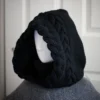 Black merino knit balaclava hood with twist edging and folded turtleneck worn by mannequin, side view