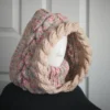 Oatmeal sprinkles knit balaclava hood with twist edging and folded turtleneck worn by mannequin, side view