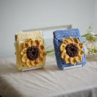 crochet sunflower squeeze pouch in yellow and blue