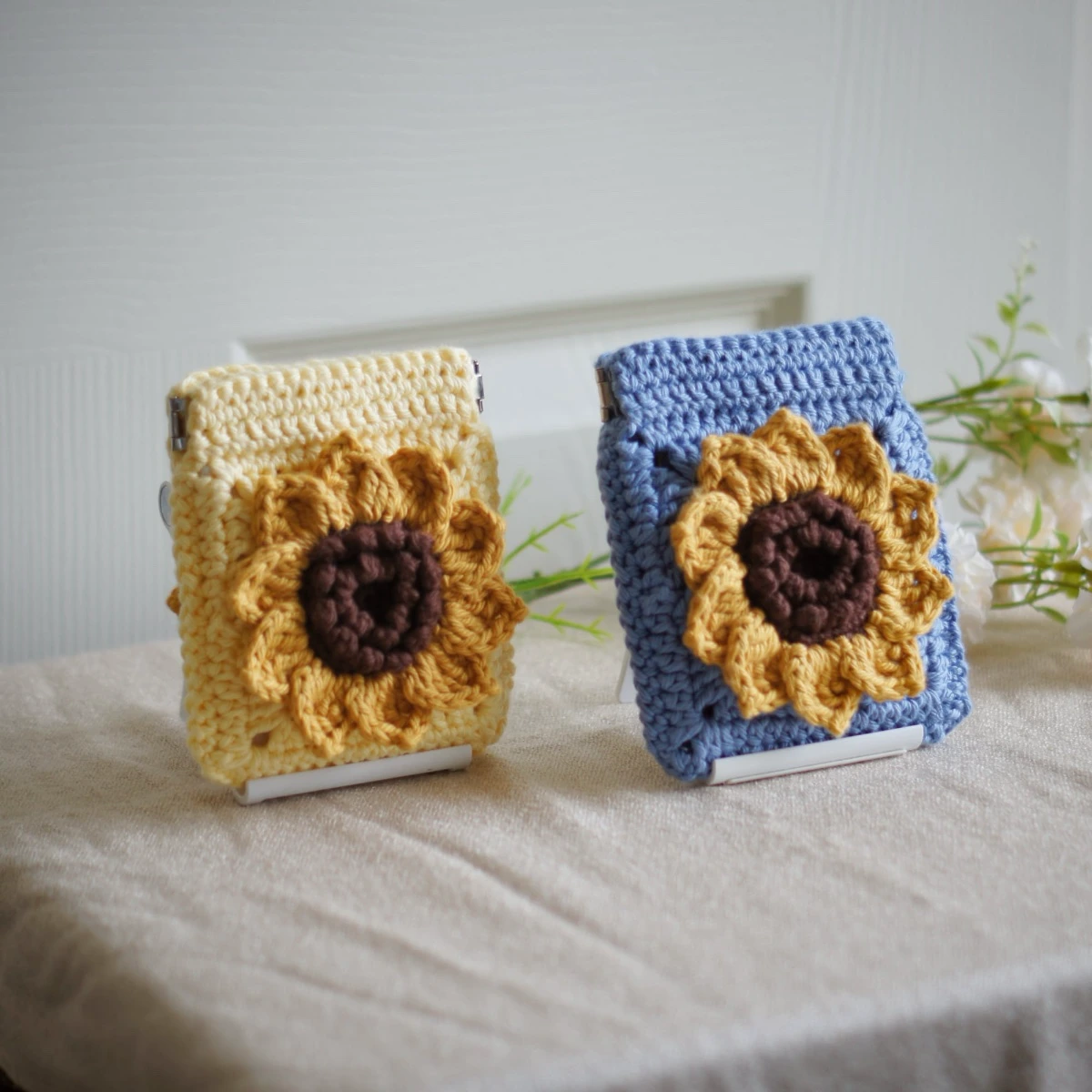 crochet sunflower squeeze pouch in yellow and blue