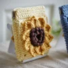 crochet sunflower squeeze pouch in yellow, side view