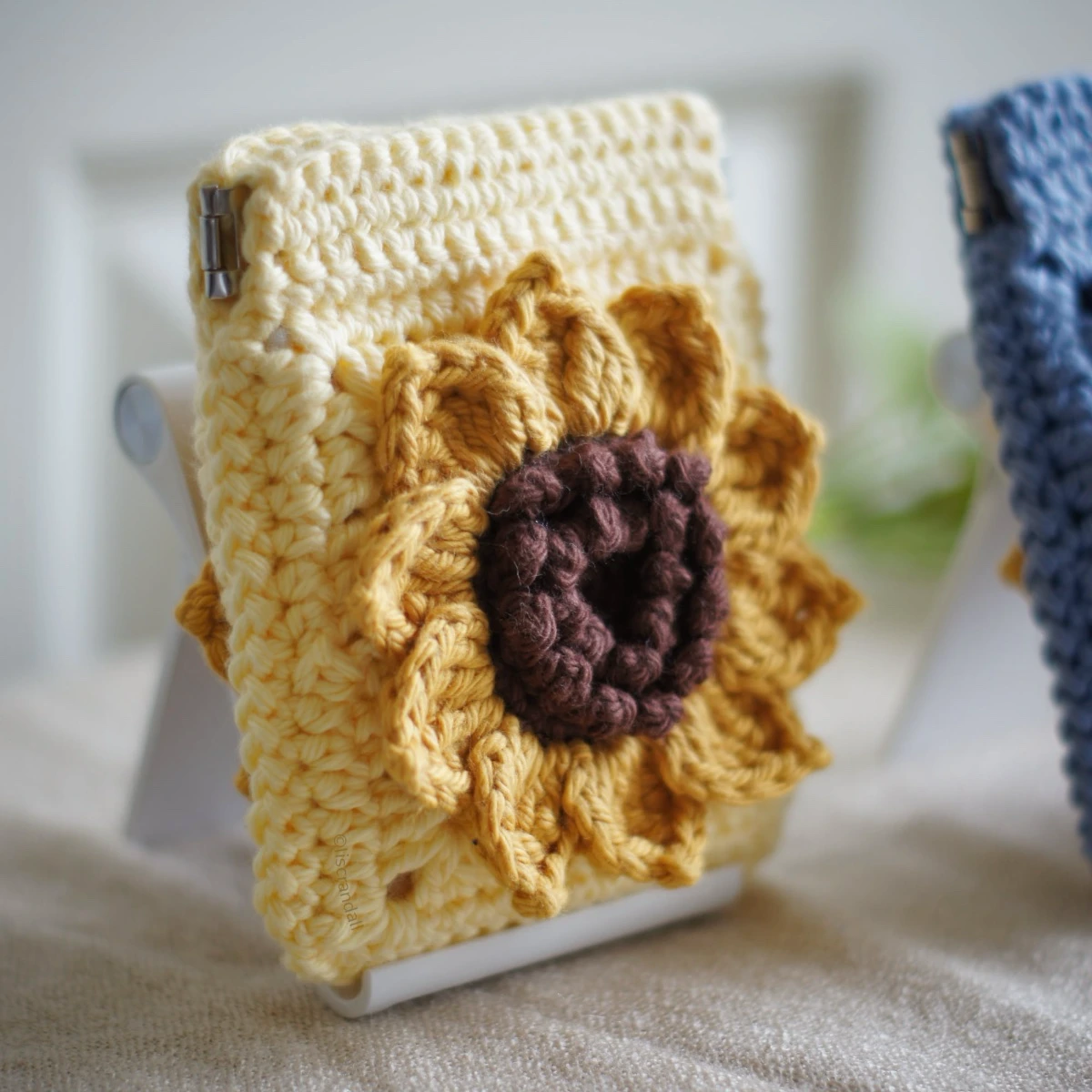 crochet sunflower squeeze pouch in yellow, side view