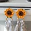 crochet sunflower kitchen towel holder with wood rings