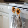 crochet sunflower kitchen towel holder with wood rings