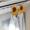 crochet sunflower kitchen towel holder with wood rings