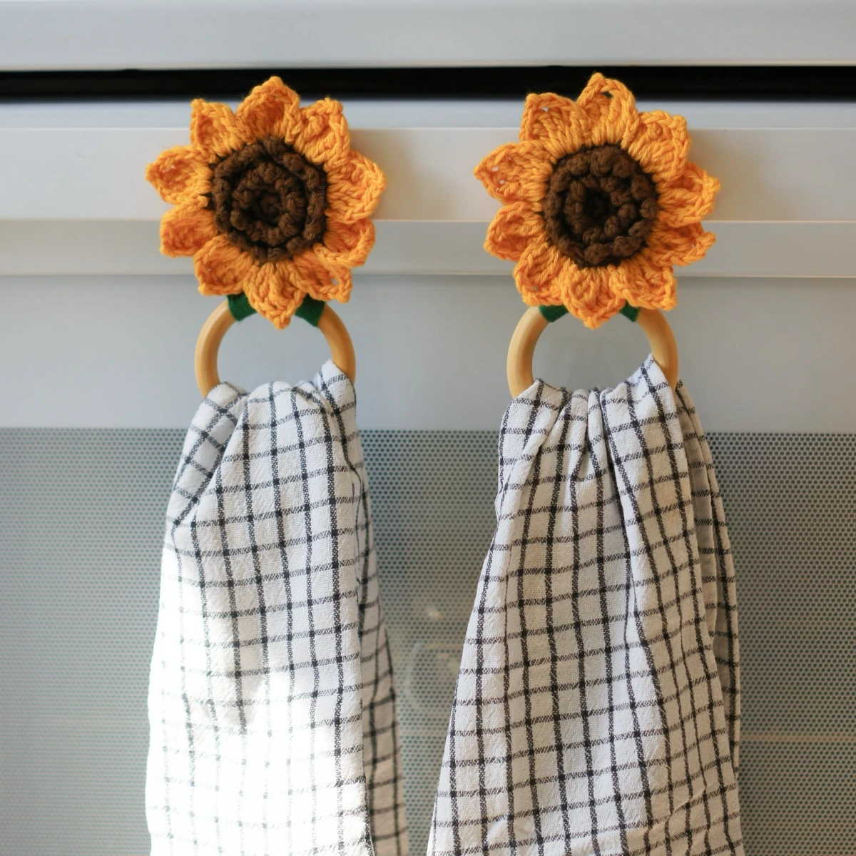 crochet sunflower kitchen towel holder with wood rings