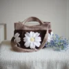 crochet daisy bag in chocolate and khaki color formed with 3D daisy granny squares. Comes with adjustable strap.