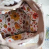 crochet daisy bag in chocolate and khaki color formed with 3D daisy granny squares. Comes with adjustable strap.